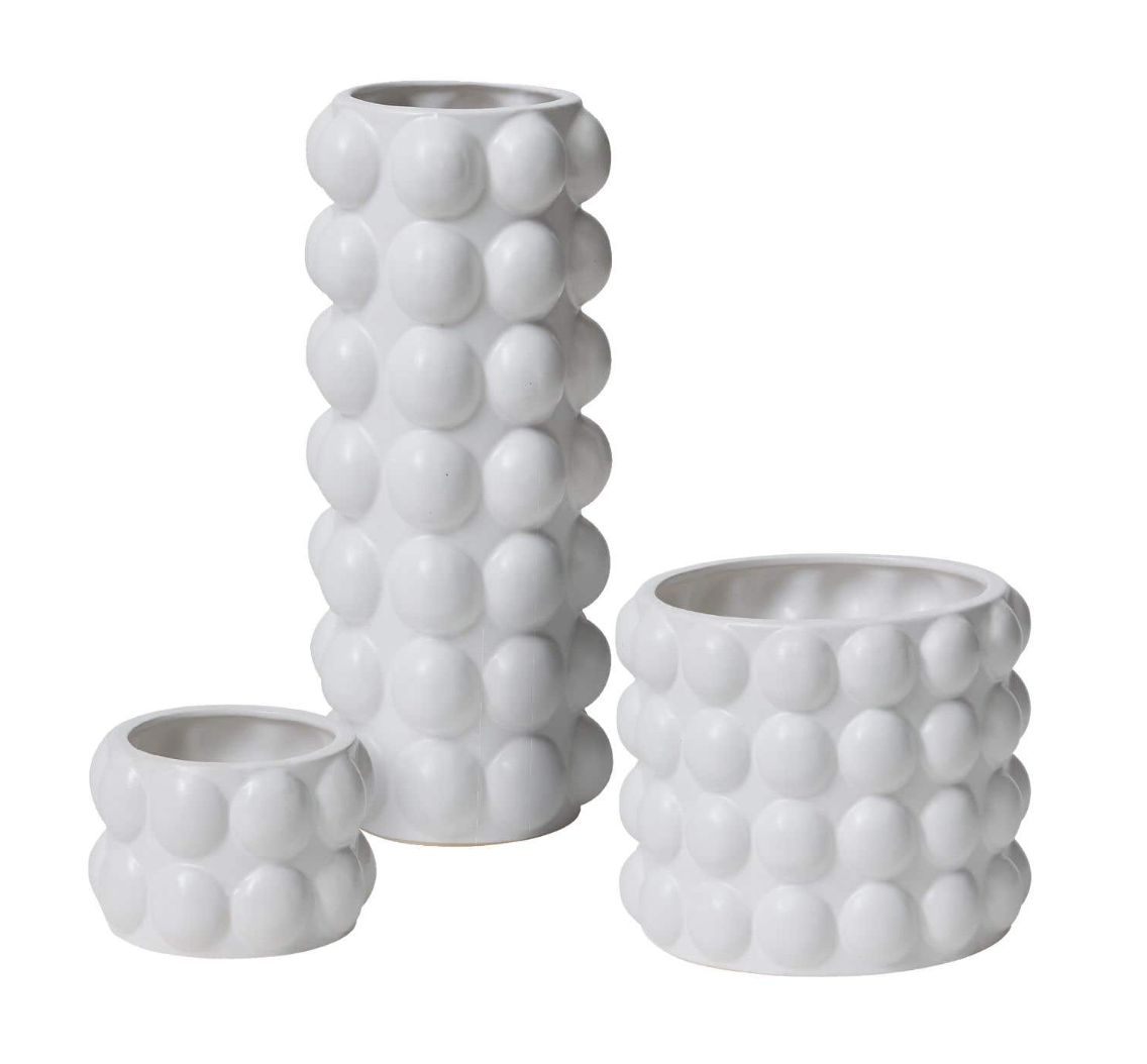 Bubble Pots have rows of bubbles on exterior with a matte white finish
