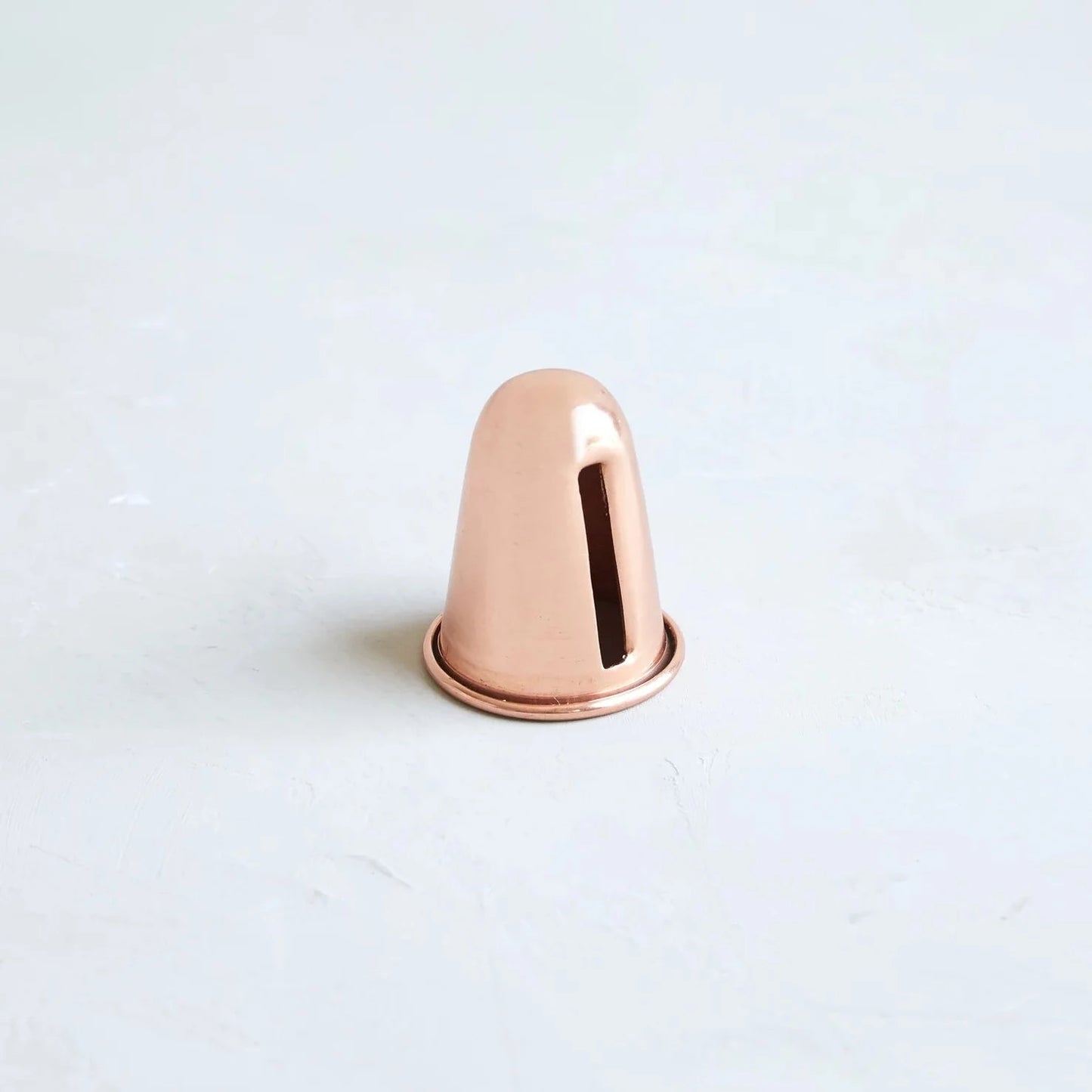 Copper candle sharpener on white background