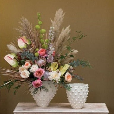 Zemora Pot with beautiful flower arrangement and floral arch