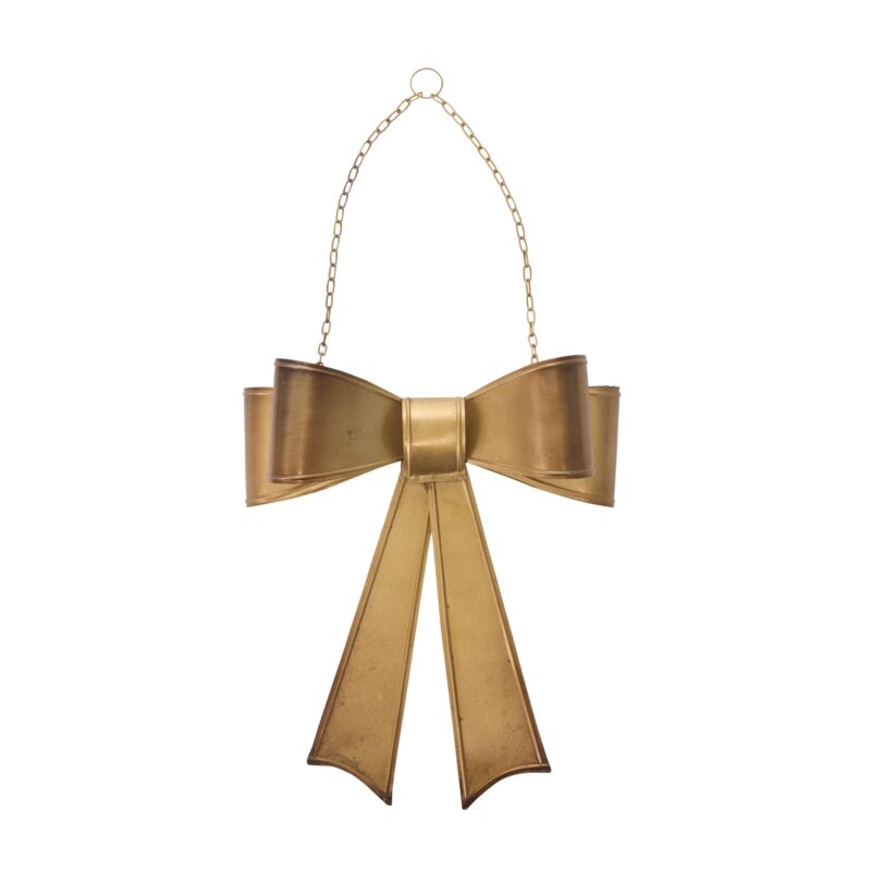 Gold bow-shaped ornament on a white background