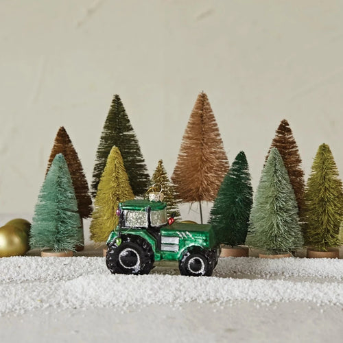Glass Tractor Ornament with Bottle Brush Trees and snow