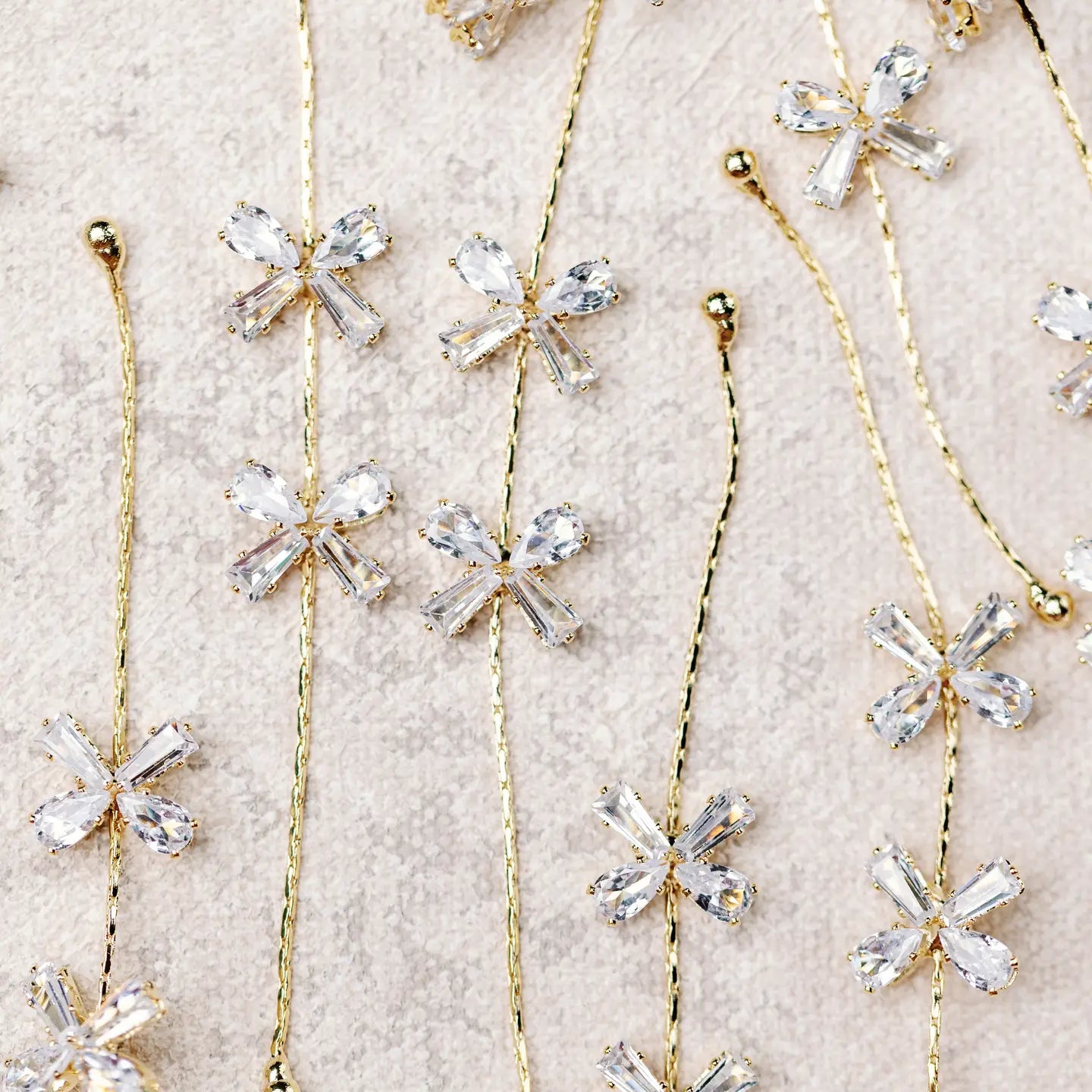Diamond Bow Gold Drop Earrings