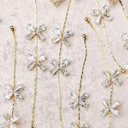 Diamond Bow Gold Drop Earrings