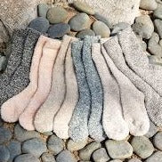 Barefoot Dreams Heather Sock Collection in 6 colors displayed on stones 