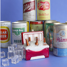 Load image into Gallery viewer, Beer cooler ornament on display with cans of beer
