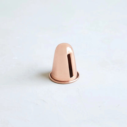 Copper candle sharpener on white background