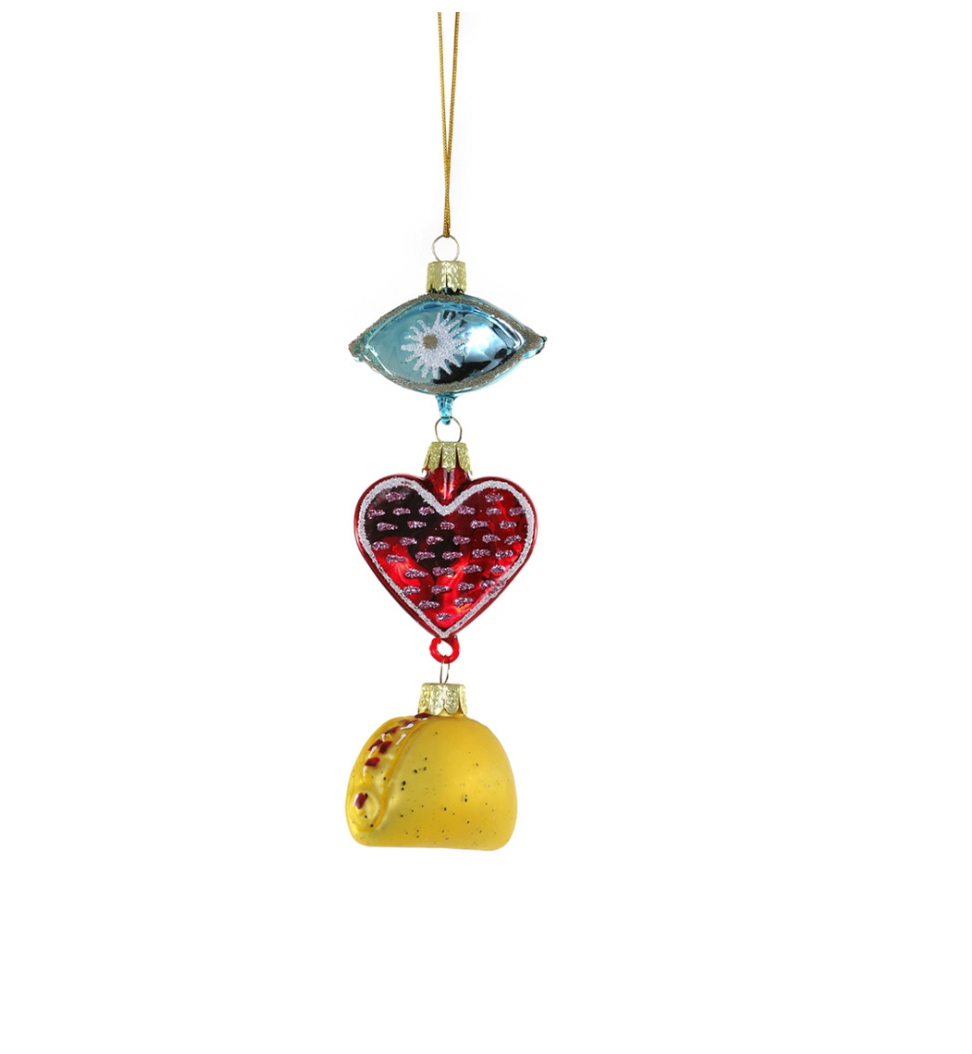 An Ornament with a eye that drops to a red heart which drops to a taco