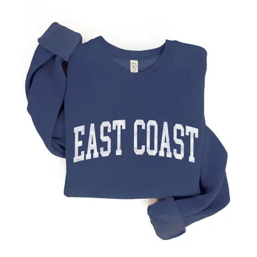 A navy blue cropped sweatshirt with 'EAST COAST' printed in white arched block letters across the chest, shown on a plain white background.