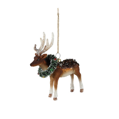 Decorative reindeer ornament with antlers and a wreath on a white background