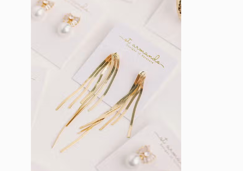 Earrings dangling on card