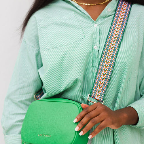 geometric pattern handbag strap with green purse