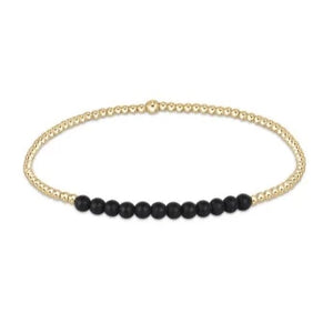 Gold beaded bracelet with black onyx beads