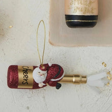 Load image into Gallery viewer, Glittery Santa on Champagne Ornament
