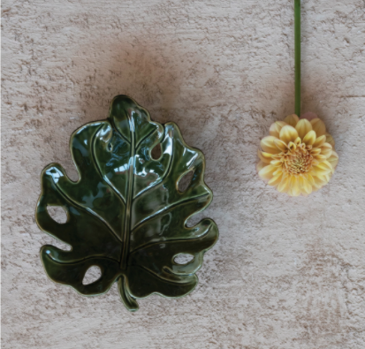 Glazed Dish with yellow dahlia laid nexct
