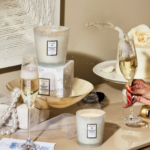 Sparkling Cuvee Hearth Candles with champagne glass and dessert