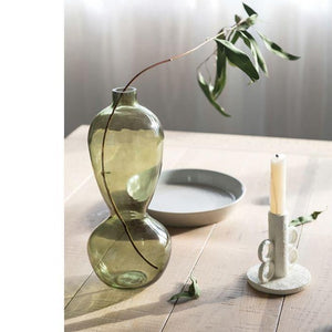 Large Green Glass Vase in fun 8 shape with branch displayed inside