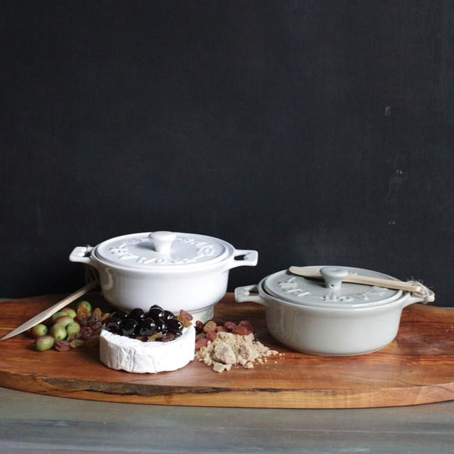 white + grey Brie Ceramic Baking Dishes on wood cutting board with Charcuterie