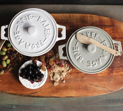 white + grey Brie Ceramic Baking Dishes on wood cutting board with Charcuterie