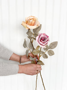 2 Faux Dried Roses in Golden + Rose Color in Woman's Hand