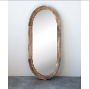 Oval Long Wood Framed mirror propped against wall
