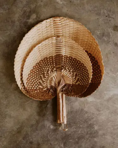 It's a fan, use it poolside to cool off in the heat or to decorate your walls with some warm, modern, natural texture. Hand woven in bali, indonesia with care and attention to detail.