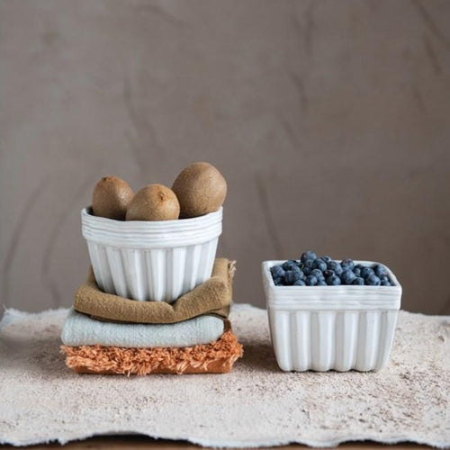 small White Ribbed bowls for kitchen with fruit inside stacked on napkins