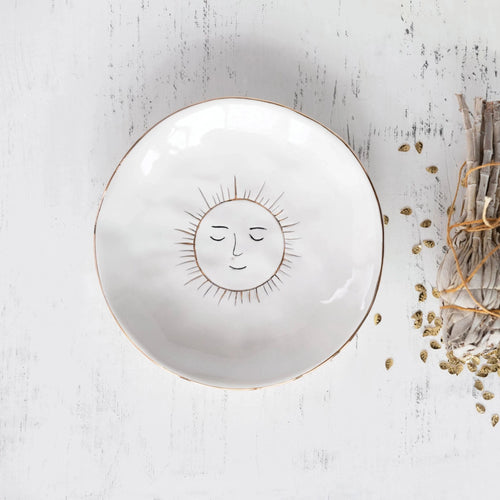 white ring dish with happy golden sun