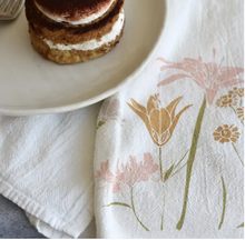 Load image into Gallery viewer, This beautiful Strength of Flowers Towel is printed with foraged florals and plants in a autumnal color palette 

