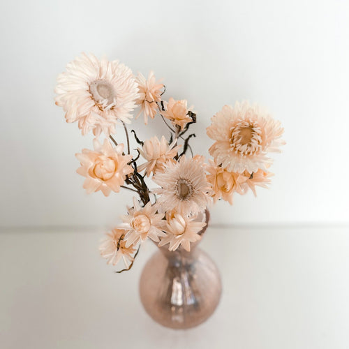 creamy flowers in iridescent vase