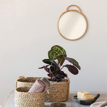 Load image into Gallery viewer, Round Mirror with Rattan Frame on wall with plant in baskets
