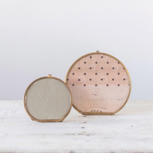 Round Brass and Glass Photo Frame shown with smaller round frame