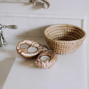 Small Kaisa Grass Basket Bowl on bathroom counter with hamsa candles