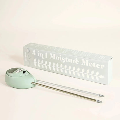 light blue  moisture meter next to retro looking matching light blue box