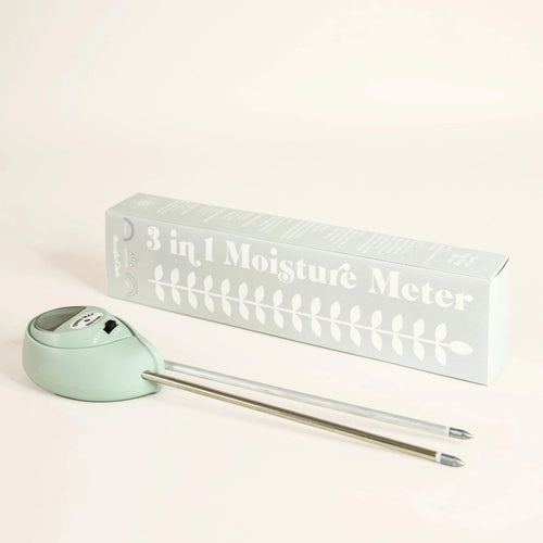 light blue  moisture meter next to retro looking matching light blue box