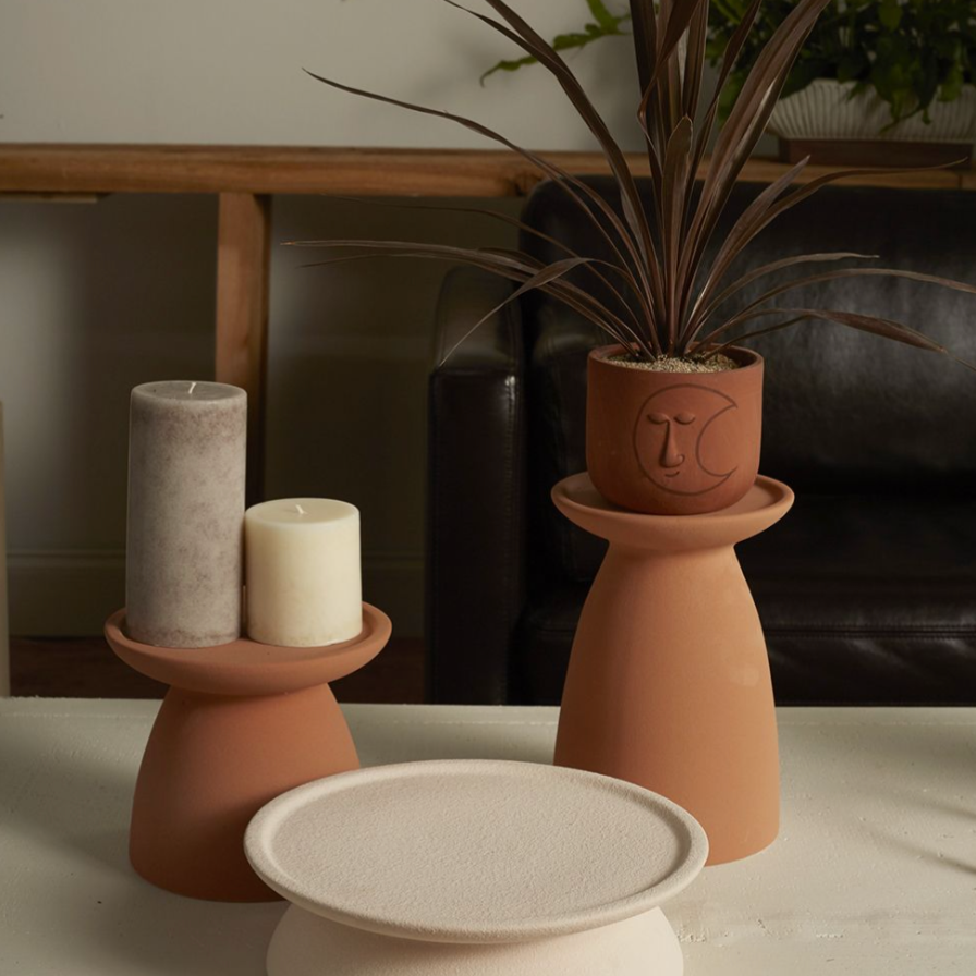 Tierra Candleholder Pedestal holding two pillar candles